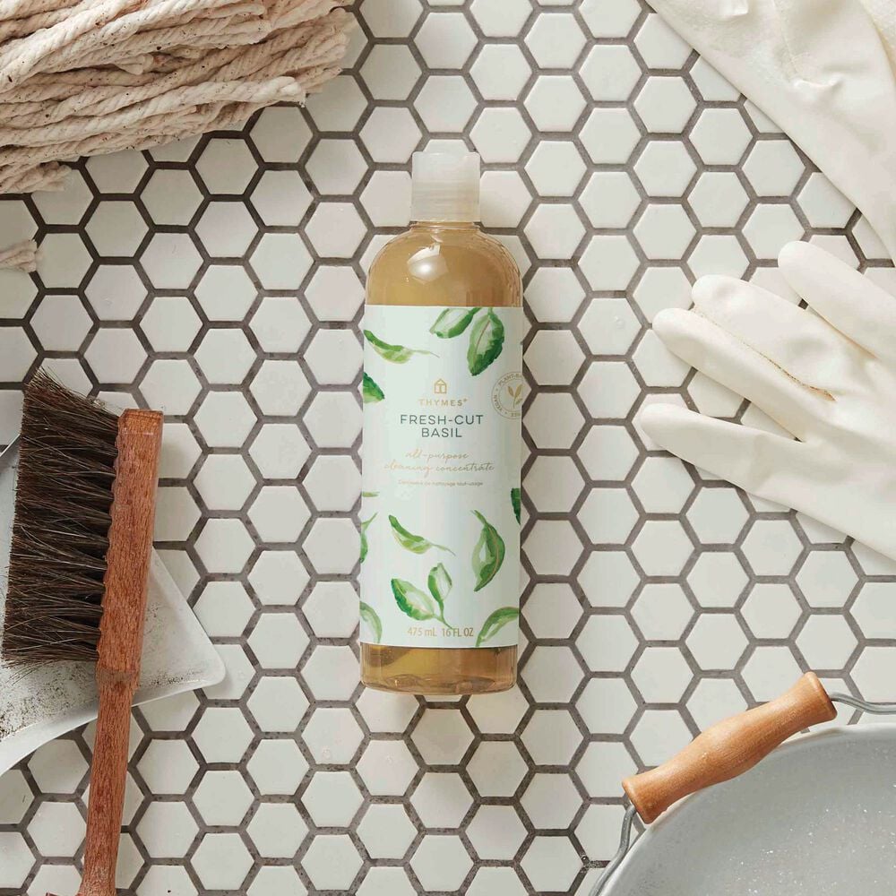 Thymes Fresh-Cut Basil All-Purpose Cleaning Concentrate for Floors and Surfaces laying on bathroom tile image number 1